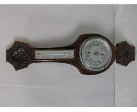An oak cased barometer