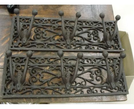 A pair of cast iron coat hooks