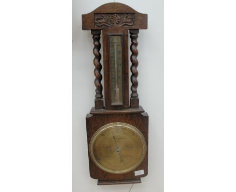 An oak cased barometer