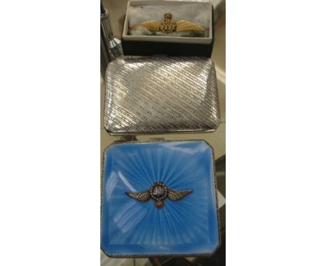 A gold RAF badge together with an enamelled RAF compact & a silver cigaretter case