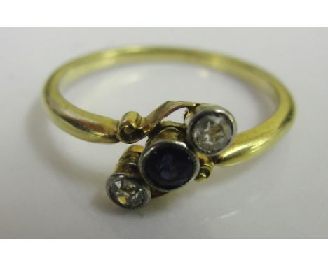 An 18ct Edwardian diamond and sapphire trilogy ring