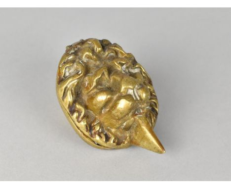 A Brass Lion Mask Door Knocker, 9cms High 