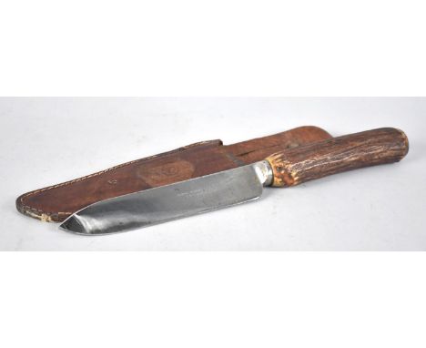 A Vintage Hunting Knife in Leather Scabbard, Blade Inscribed Thomas Wood &amp; Son, Chester, Bone Handle, 28cms Long 