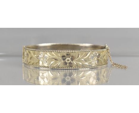 A Vintage Silver Hinged Bangle having Textured Floral Decoration, Birmingham Hallmark for 1991 and Makers Mark B.Ltd 