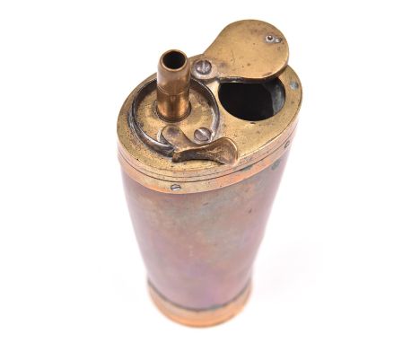 A 3 way brass mounted copper powder flask, 4½” overall, with tapered body and screw lid to base. GO &amp; C £60-70.