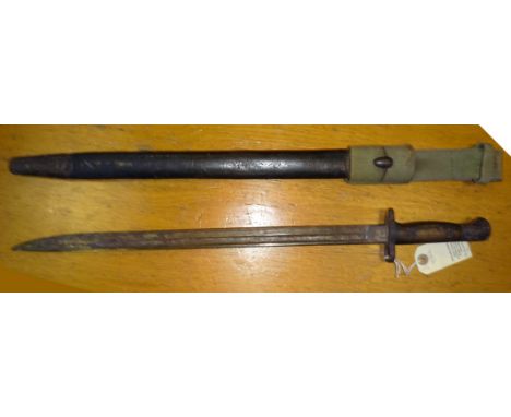 A 1907 pattern bayonet for the SMLE rifle, in its scabbard with khaki webbing frog. GC (surface rust to blade, patches of rus