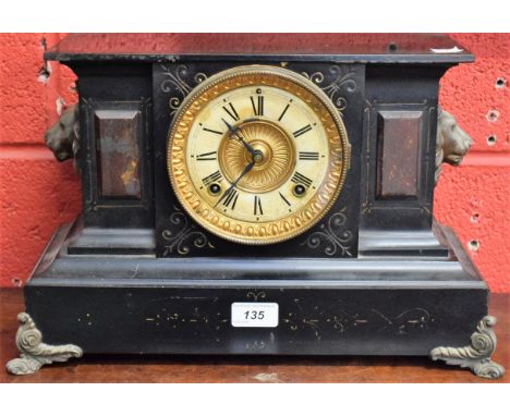 An American mantel clock, Antonia, New York, lion mask handles, scroll feet, 41cm wide overall