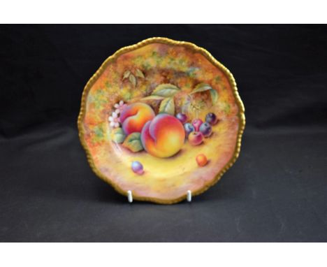 A Royal Worcester shaped circular plate, painted by P English, signed with ripe peaches and cherries on a mossy bank, gilt bo