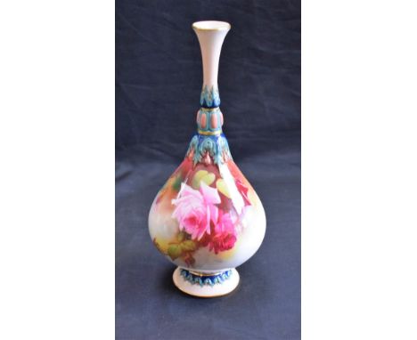 A Royal Worcester bottle vase, in the manner of James Hadley, painted with cabbage roses, the neck and base in relief with st