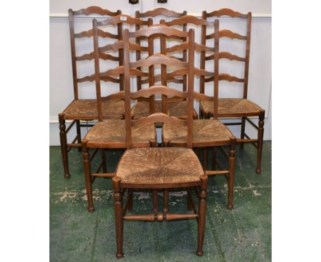 A set of six rush seated cottage ladder backed dining chairs
