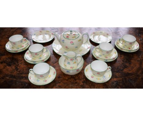 A Wedgwood tea service, for six, painted with sprigs of country flowers, green border, pattern no WH1856, comprising cups, sa