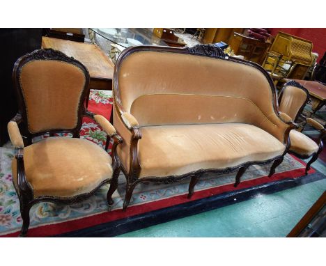 A 19th century mahogany composed drawing room suite, comprising a sofa and a pair of similar elbow chairs, carved with shells