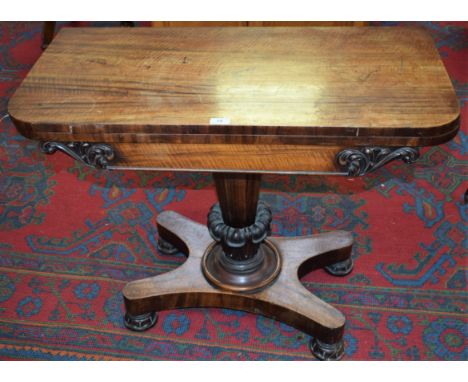 A William IV rosewood rounded rectangular card table, folding top enclosing a baize lined playing surface above a deep frieze