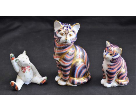 A Royal Crown Derby paperweight, Cat, silver stopper; another, smaller, silver stopper, second quality; model Teddy Bear (3) 