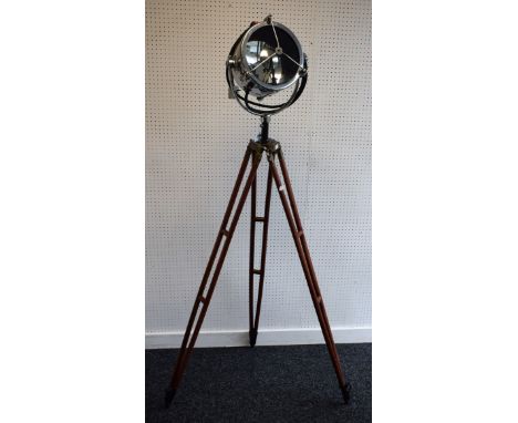 A salvaged lamp, chromium-plated search light on brass mounted hardwood stand 