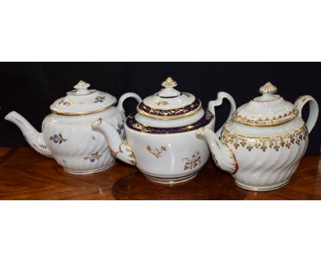 A Chamberlain Worcester spirally fluted oval teapot and cover, decorated with a gilt border of leafy tendrils, domed cover, C