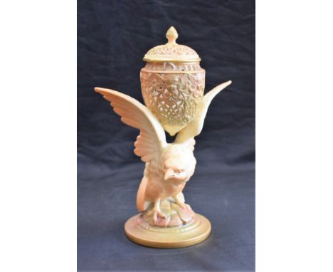 A Graingers Worcester reticulated vase and cover, supported on the wings of an eagle, in blush ivory and burnished gilt, 23cm