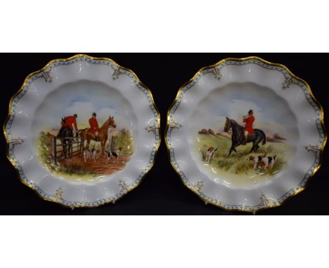 A pair of Royal Crown Derby wavy edged hunting plates, signed J Doyle