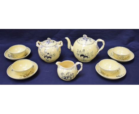 A Leeds Pottery morning tea service, probably by James Senior, decorated in silver lustre with fruit and foliage on a yellow 