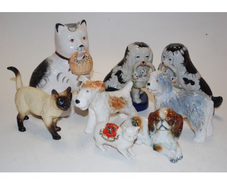 A quantity of ceramic dog and cat ornaments to include crested Manx cat