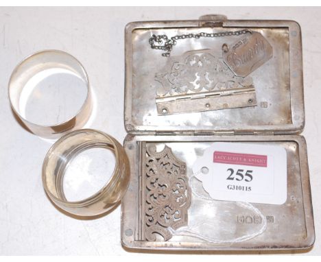 Silver wares to include pocket cigarette case, decanter collar, and two napkin rings