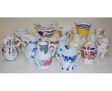 A collection of 15 miniature porcelain jugs to include Blush Ivory, Royal Worcester blush ivory, Royal Worcester Giles Cornuc