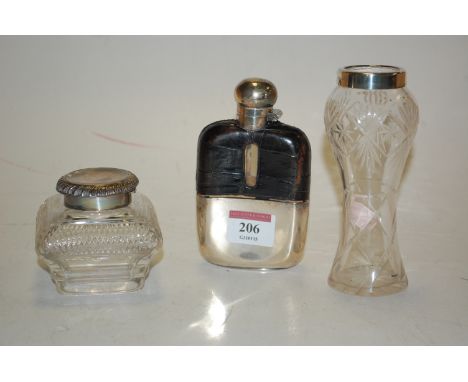 A cut glass and silver topped specimen vase, silver topped glass inkwell, and a plated and leather bound glass hip flask (3)