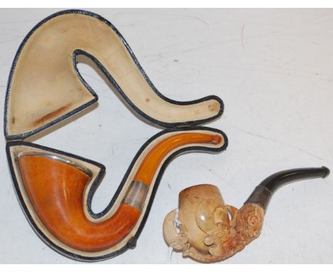 A cased silver rimmed cornucopia pipe; together with a carved meerschaum pipe (2)
