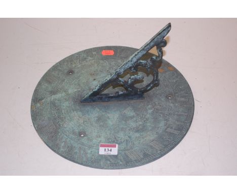 A reproduction bronzed metal sundial 
