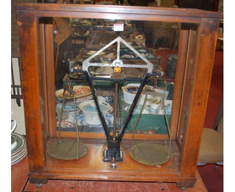 A wooden cased set of scientific scales by HM Stanley