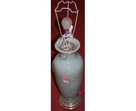 A blue ground crackle glazed stoneware table lamp with plated foot rim, lacking shade 