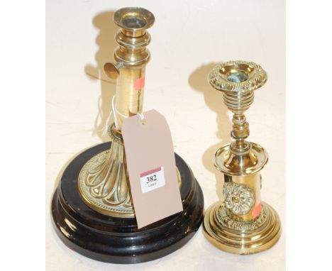 A Victorian brass telescopic candlestick mounted on a plinth together with one other