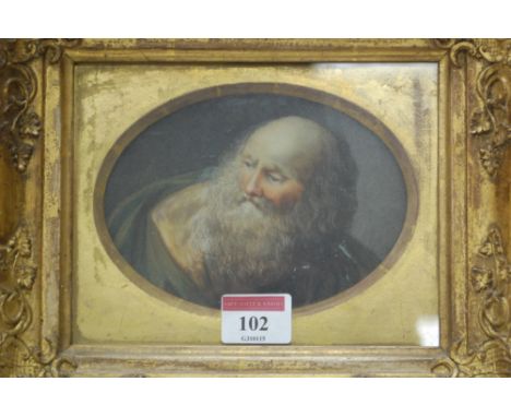 A late 19th century painted porcelain plaque, possibly Berlin, framed as an oval, depicting head and shoulders portrait of a 