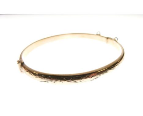 9ct gold snap bangle of hollow design, 8.3g approx  
