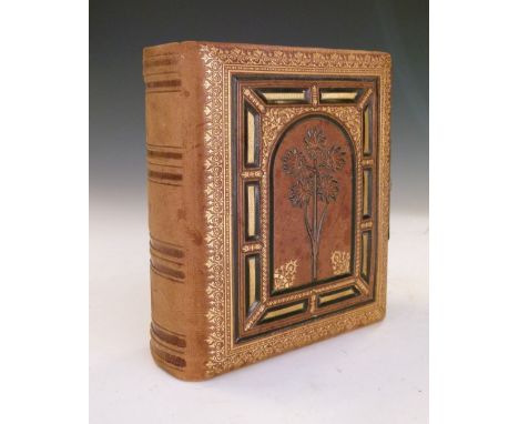 Late Victorian album of photographic portrait cards in gilt surrounds, with decorated front board, 16.5cm high  