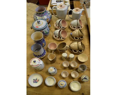 Selection of mid-century Poole pottery to include a 1930's/40's bulbous vase, 13cm high, two further vases and biscuit barrel