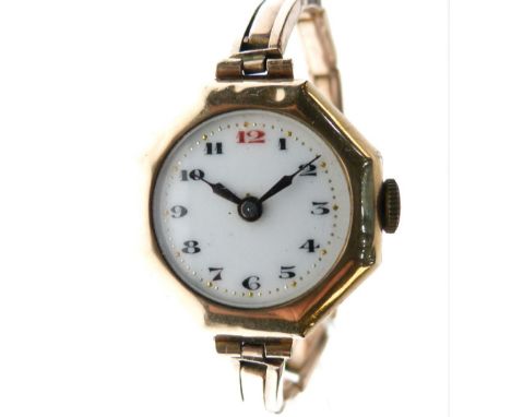 Lady's 9ct gold wristwatch, white circular Arabic dial with red 12 within octagonal surround, Swiss manual-wind movement, 25m