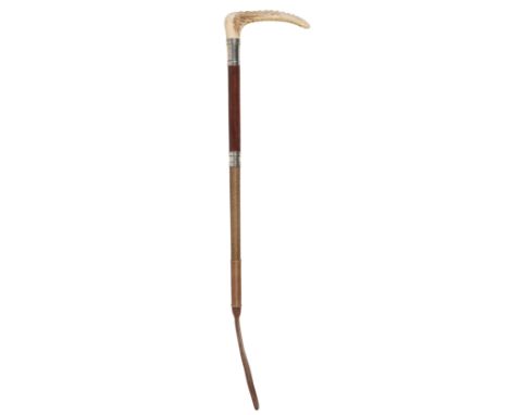 AN EDWARDIAN GENTLEMAN'S HUNTING CROP with antler handle, nickel silver collar, leather grip and plaited leather shaft, 51cm 