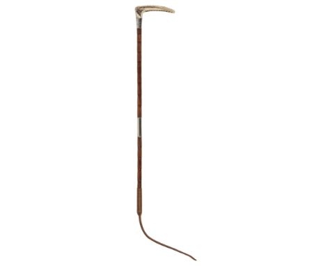 AN EDWARDIAN BOYS HUNTING CROP with antler handle, silver collar and ribbed bamboo shaft, by Davis Wilson, the silver collar 