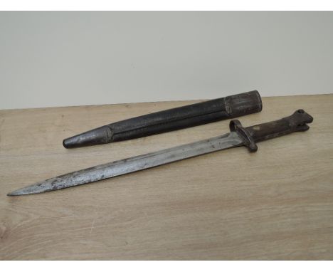 A British Lee Enfield Bayonet MKI with double edged blade, blade marked VR 9 92 Wilkinson, on reverse WD with broad arrow 49W