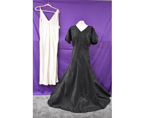 A stunning 1930s art deco bias cut black gown having wonderful slit details to puff sleeves and to back, feels to be silk/ si