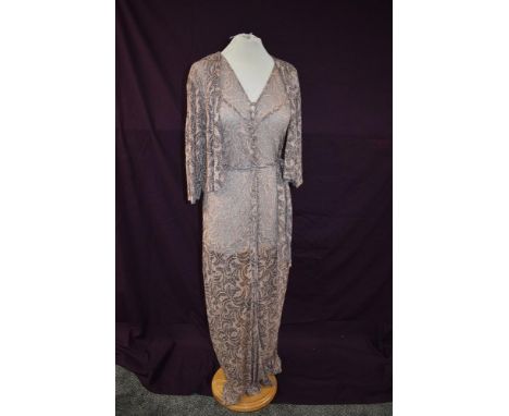 A 1930s full length lace art deco dress and matching jacket in pink and black.
Superb condition for age, small break near a b