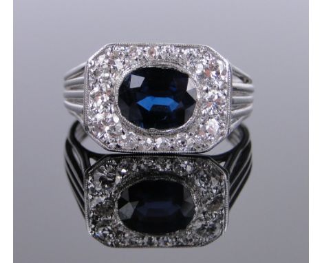 An Art Deco style sapphire and diamond set panel ring,
sapphire 7mm across, total diamond content approx. 0.85cts, setting wi