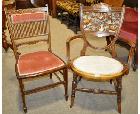 A Victorian beech bedroom chair,
the shield shaped back having an inset relief carved and pierced fruit design panel, togethe