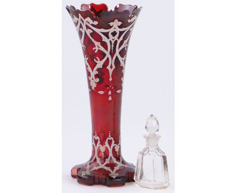 A cut-glass scent bottle and stopper 
and a ruby glass vase with enamelled and gilded decoration, height 10.75".