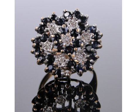 A large 9ct gold sapphire and diamond cluster ring,
panel 20mm across, size L.