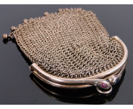 A French silver gilt evening purse,
with ruby, sapphire and diamond set snakehead clasp, width 55mm.