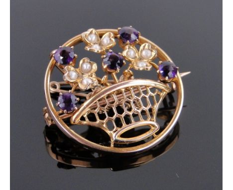 A 9ct gold amethyst and pearl set flower basket design brooch,
25mm across.