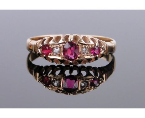 An 18ct gold ruby and diamond cluster ring,
size N.