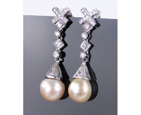 A pair of diamond and pearl set drop earrings,
unmarked white gold settings, length 35mm, pearls 10mm across.